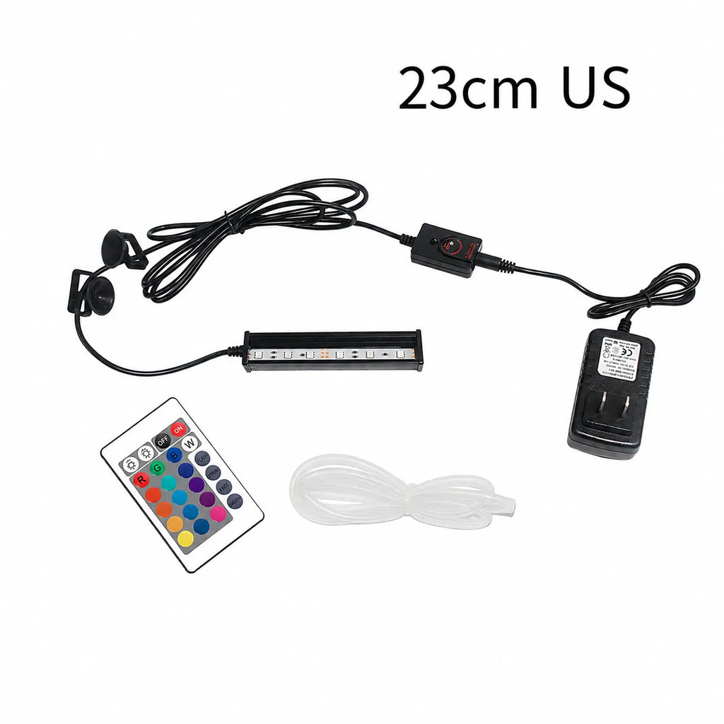 23cm RGB LED aquarium light kit with US power adapter, inline controller, remote control, suction cup mounts, and clear air tubing for aquarium installation.