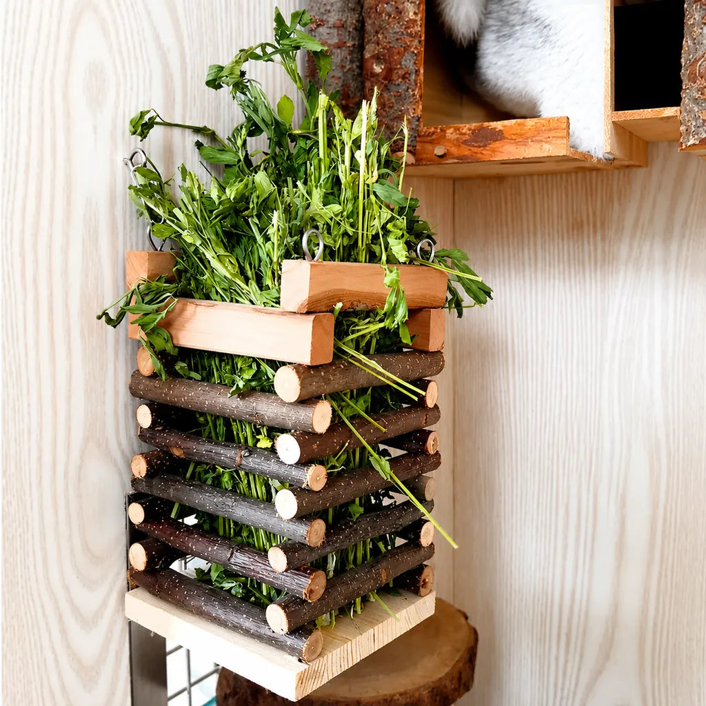 Rustic natural wooden rabbit hay feeder made from real wood branches. Ideal for rabbits, guinea pigs, chinchillas, and other small pets. Durable hanging hay rack that keeps forage clean, accessible, and encourages natural feeding behavior.