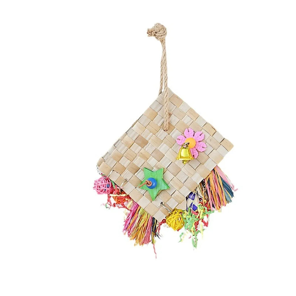 Handwoven hanging bird toy made from natural palm leaf with colourful shredding paper, wooden star, rattan balls and bell for parrots and pet birds.